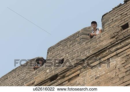 Tourists at the terrace of a fort at the Great Wall of China, Changping District, Beijing, China View Large Photo Image Stock Image - Tourists at the terrace of a fort at the Great Wall of China, Changping District, Beijing, China. Fotosearch