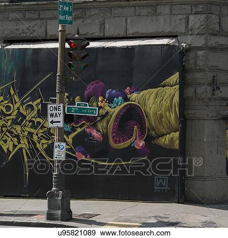 Stock Photo - Traffic signal in front of a giant poster, Pioneer Square, Seattle, Washington State, USA. Fotosearch