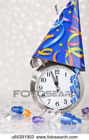 Alarm clock with party decoration View Large Photo Image Stock Image - Alarm clock with party decoration. Fotosearch