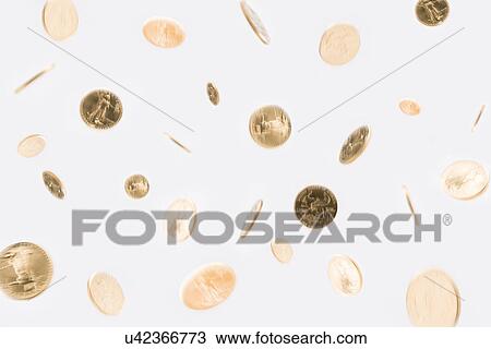 Stock Image - American coins falling against white background. Fotosearch