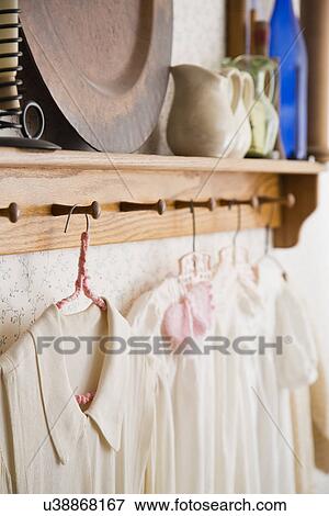 Stock Photo - Antique shirts on hangers. Fotosearch