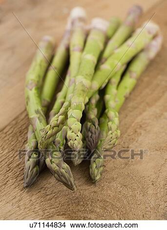 Asparagus on table View Large Photo Image Picture - Asparagus on table. Fotosearch