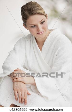Stock Photo - Attractive woman wearing bathrobe. Fotosearch