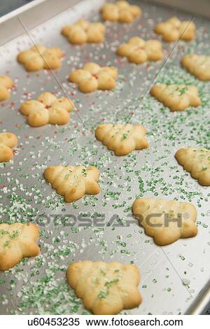 Stock Photography - Baked spritz cookies on baking sheet. Fotosearch