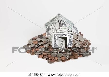 Banknote house on pile of coins View Large Photo Image Stock Image - Banknote house on pile of coins. Fotosearch