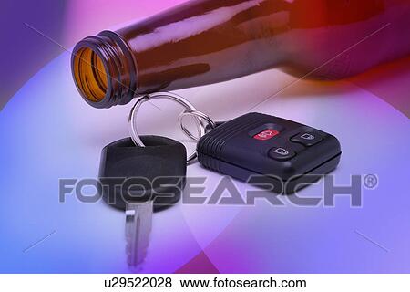 Stock Photo - Beer bottle and car keys. Fotosearch