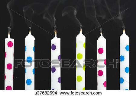 Birthday candles against black background View Large Photo Image Picture - Birthday candles against black background. Fotosearch