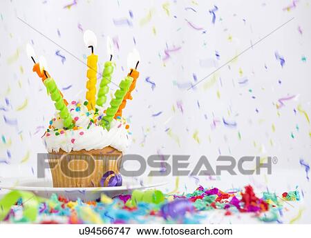 Birthday cupcake and confetti View Large Photo Image Stock Photo - Birthday cupcake and confetti. Fotosearch