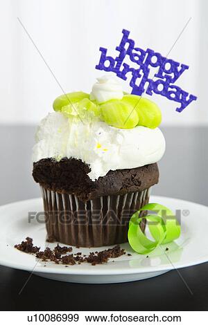 Birthday cupcake, close-up View Large Photo Image Stock Photo - Birthday cupcake, close-up. Fotosearch
