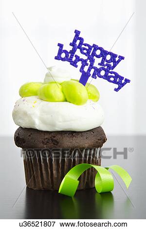 Birthday cupcake, close-up View Large Photo Image Stock Photo - Birthday cupcake, close-up. Fotosearch