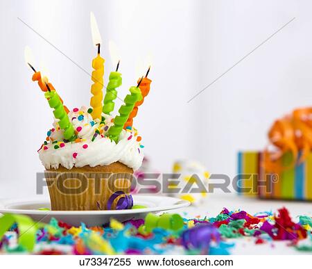 Birthday cupcake with candles View Large Photo Image Stock Photography - Birthday cupcake with candles. Fotosearch
