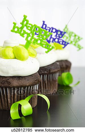 Stock Photography - Birthday cupcakes, close-up. Fotosearch