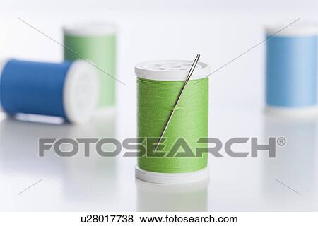 Blue and green threads with needle View Large Photo Image Stock Photo - Blue and green threads with needle. Fotosearch
