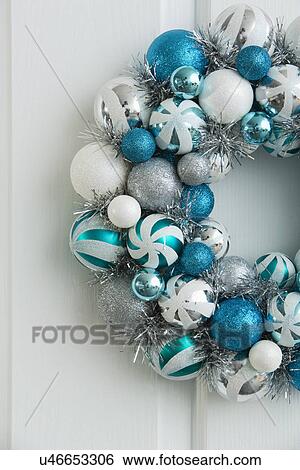 Blue wreath hanging on white door View Large Photo Image Stock Photograph - Blue wreath hanging on white door. Fotosearch