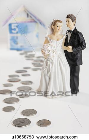 Bride and groom on money path near banknote house View Large Photo Image Stock Image - Bride and groom on money path near banknote house. Fotosearch