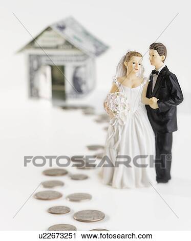 Bride and groom on money path near banknote house View Large Photo Image Stock Image - Bride and groom on money path near banknote house. Fotosearch
