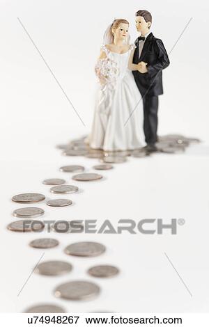 Stock Photo - Bride and groom on money path. Fotosearch