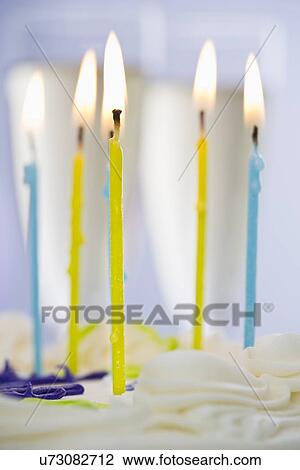 Burning candles on cake View Large Photo Image Stock Image - Burning candles on cake. Fotosearch