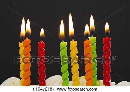 Burning candles on cake View Large Photo Image Stock Photo - Burning candles on cake. Fotosearch