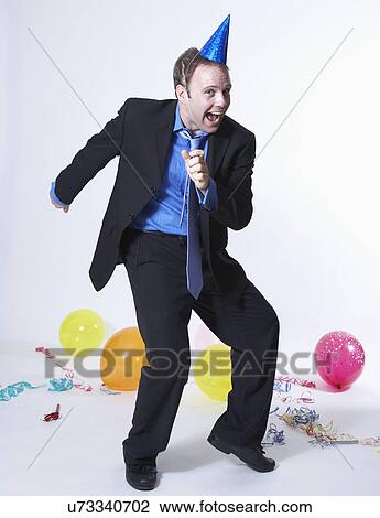 Businessman celebrating party View Large Photo Image Stock Image - Businessman celebrating party. Fotosearch