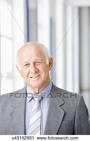 Businessman holding briefcase, portrait View Large Photo Image Stock Image - Businessman holding briefcase, portrait. Fotosearch