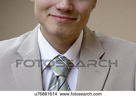 Businessman smiling, mid section View Large Photo Image Picture - Businessman smiling, mid section. Fotosearch