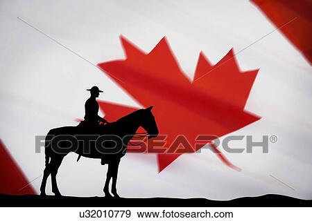Canadian police officer on horse against background of Canadian flag View Large Photo Image Stock Photo - Canadian police officer on horse against background of Canadian flag. Fotosearch