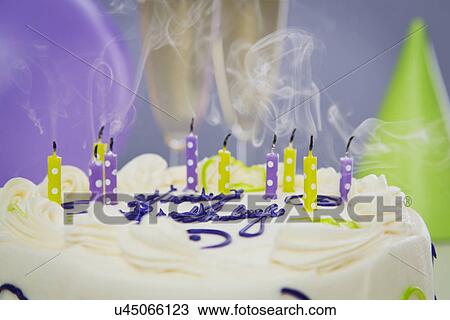 Stock Image - Candles on cake. Fotosearch