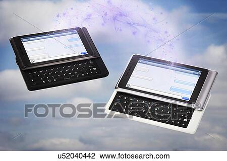 Stock Image - Cell phones in heaven. Fotosearch