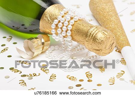 Champagne bottle with pearls View Large Photo Image Stock Photograph - Champagne bottle with pearls. Fotosearch
