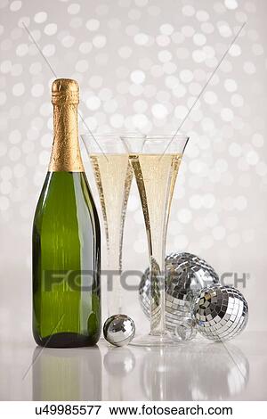 Champagne glass and bottle and disco balls View Large Photo Image Stock Photo - Champagne glass and bottle and disco balls. Fotosearch