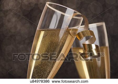 Stock Photograph - Champagne in champagne flutes. Fotosearch