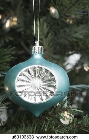 Stock Image - Christmas bauble on Christmas tree. Fotosearch
