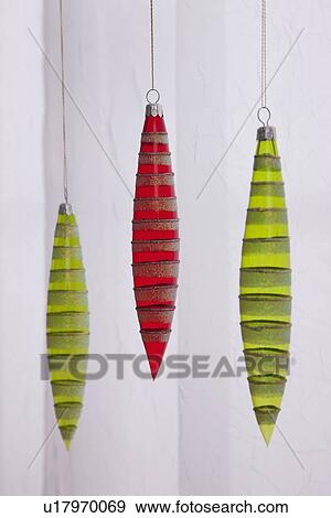 Christmas baubles hanging, studio shot View Large Photo Image Stock Photo - Christmas baubles hanging, studio shot. Fotosearch