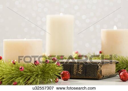 Stock Photo - Christmas candles and bible. Fotosearch