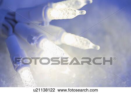 Christmas lights on snow View Large Photo Image Stock Image - Christmas lights on snow. Fotosearch