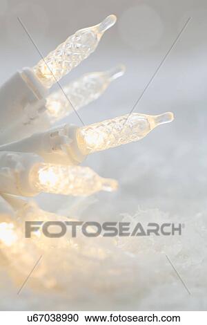 Christmas lights on snow View Large Photo Image Stock Image - Christmas lights on snow. Fotosearch