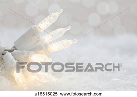 Stock Photography - Christmas lights on snow. Fotosearch