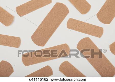 Close up of adhesive bandages, studio shot View Large Photo Image Stock Image - Close up of adhesive bandages, studio shot. Fotosearch