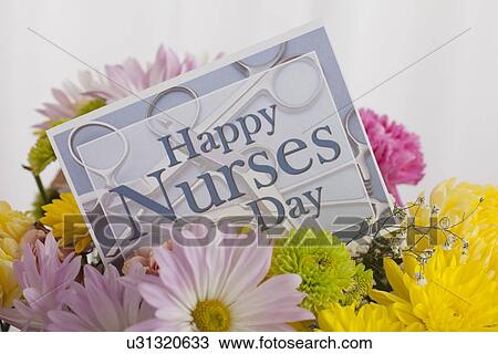 Stock Image - Close up of bouquet and greeting card for Nurses Day. Fotosearch