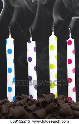 Stock Photography - Close-up of candles on cake. Fotosearch