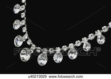Close-up of diamond necklace on black background View Large Photo Image Stock Photo - Close-up of diamond necklace on black background. Fotosearch