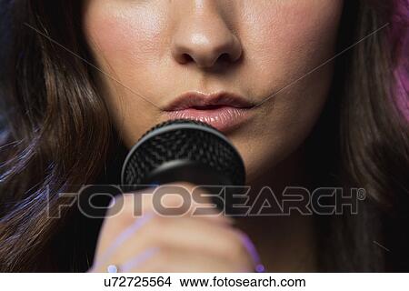 Close-up of female singer on stage View Large Photo Image Picture - Close-up of female singer on stage. Fotosearch