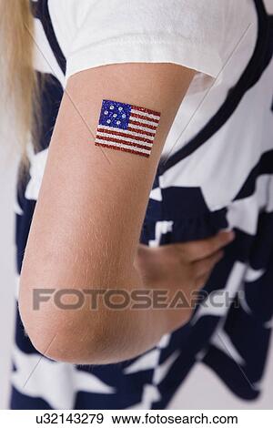 Close-up of girl's (8-9) arm with American flag painted View Large Photo Image Stock Photo - Close-up of girl's (8-9) arm with American flag painted. Fotosearch