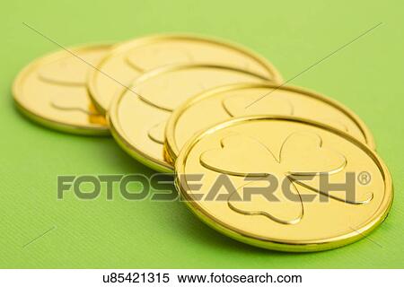 Close up of gold coins with shamrock pattern View Large Photo Image Stock Photography - Close up of gold coins with shamrock pattern. Fotosearch