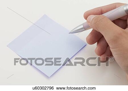 Close-up of human hand with adhesive note View Large Photo Image Stock Photograph - Close-up of human hand with adhesive note. Fotosearch