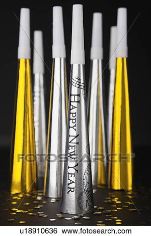 Close up of new year's eve party horn blowers View Large Photo Image Stock Photograph - Close up of new year's eve party horn blowers. Fotosearch