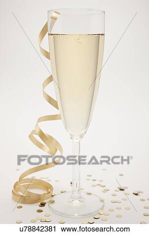 Stock Image - Close up of new year's eve party champagne flute. Fotosearch