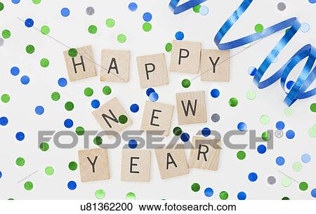 Stock Image - Close up of new year's eve party decorations with confetti. Fotosearch
