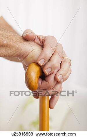 Close up of senior man's hands, leaning on cane View Large Photo Image Stock Photo - Close up of senior man's hands, leaning on cane. Fotosearch